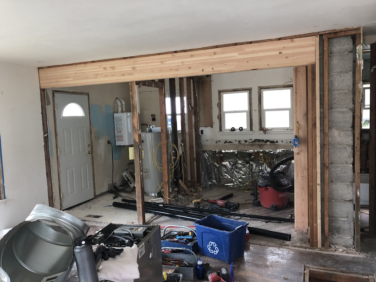 Beam header installed where load bearing wall was removed between kitchen and living area